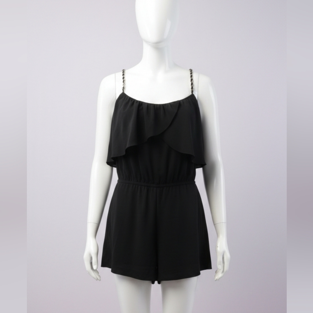 Bebe Black Romper With Gold chain-link straps and a ruffled bodice. Size Small